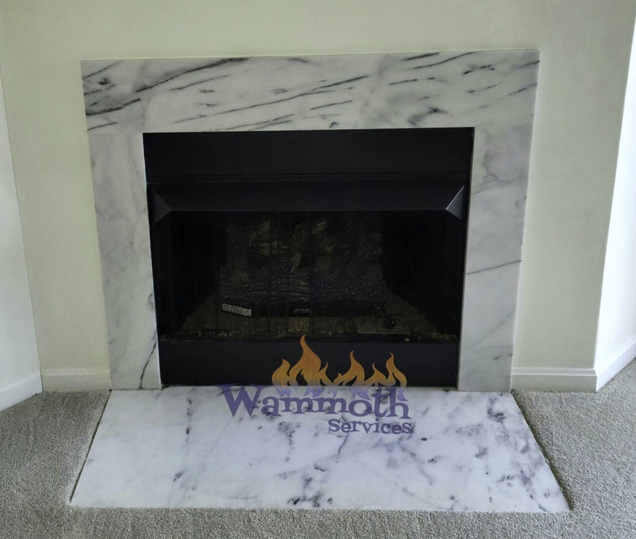 gas fireplace turned off with front marble hearth