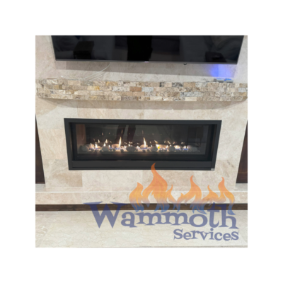 A fireplace with the words wammoth services on it.