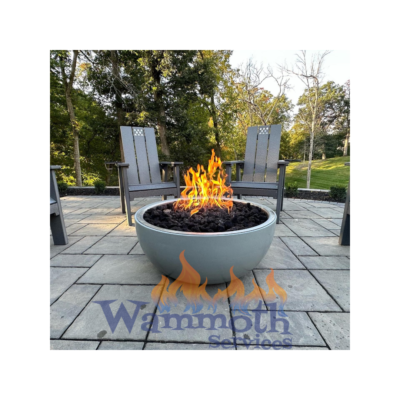 A fire pit sitting on top of a patio.